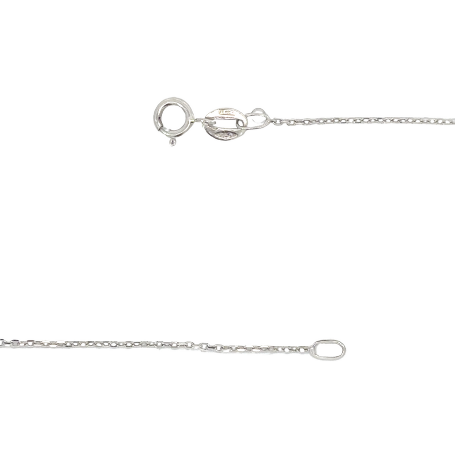 Woman wearing 18k gold heart necklace with diamond