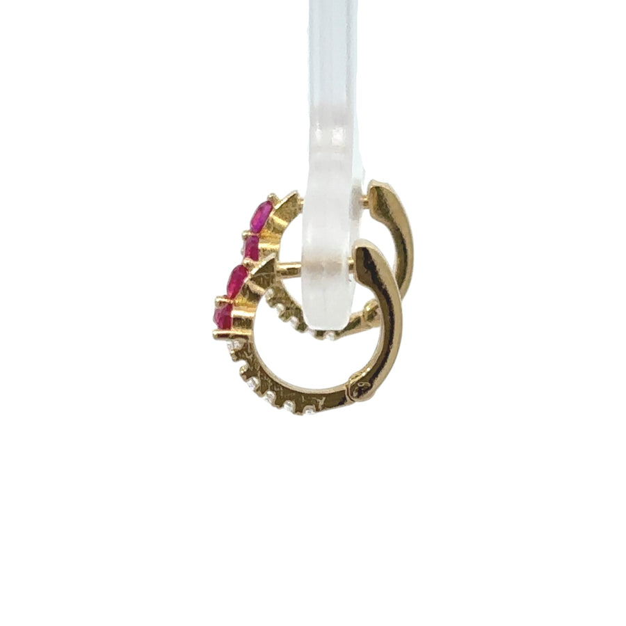 Classic 18k gold earrings on white display