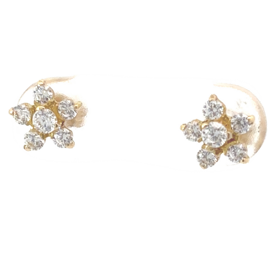 18k gold flower stud earrings displayed on neutral background