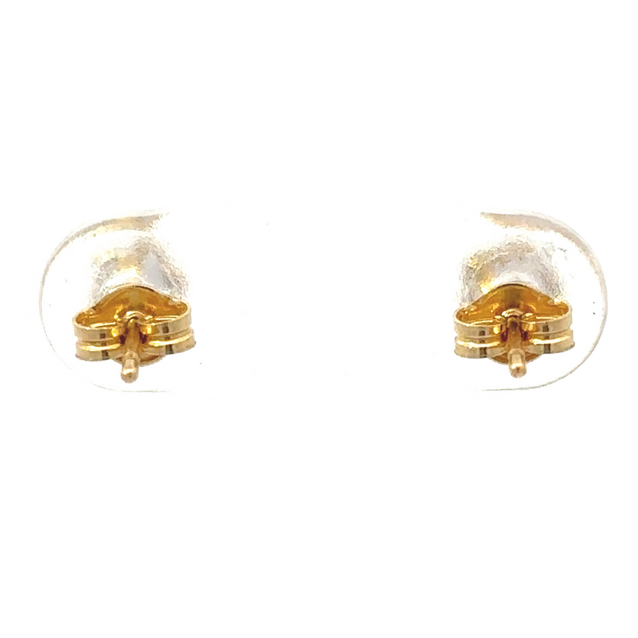 Baby wearing 18k gold stud star earrings, adding charm and elegance
