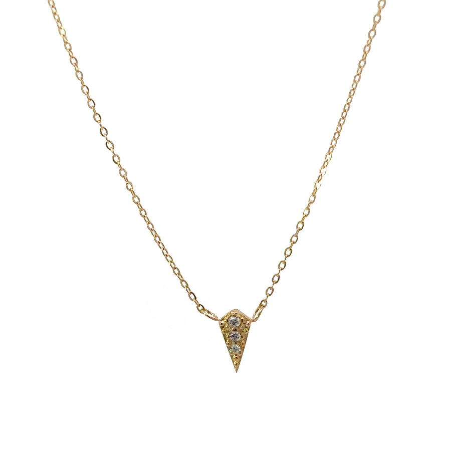 Close-up of triangle charm on minimalist gold chain