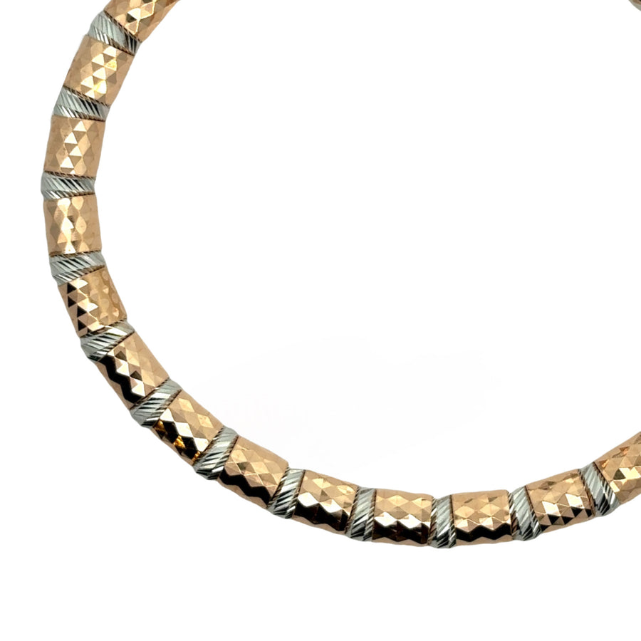 Women’s 6.5 cm two-tone gold bracelet worn on wrist