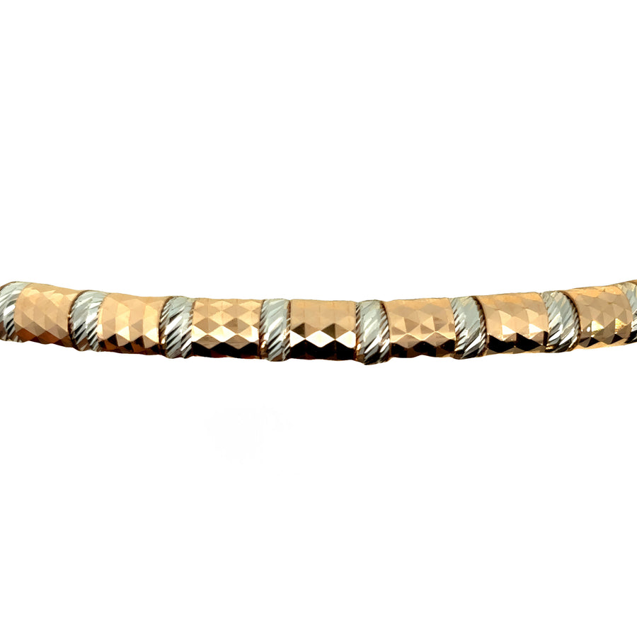 Bracelet laid flat showcasing two-tone 18k gold finish