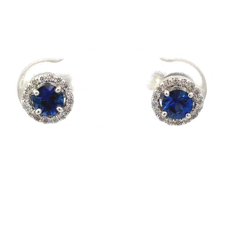 Pair of 18k gold earrings with center blue stone on white background