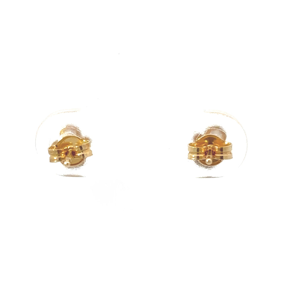 Classic round 18k gold baby earrings on pink background