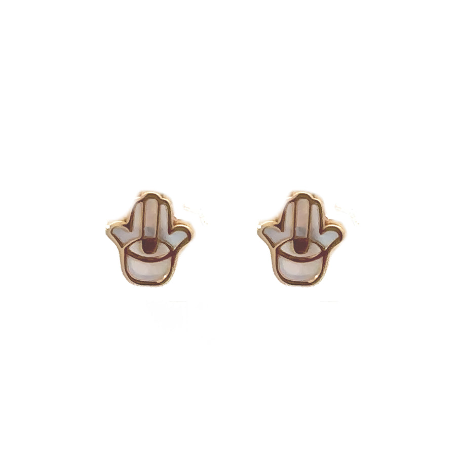 Close-up of baby-sized 18k gold stud earrings
