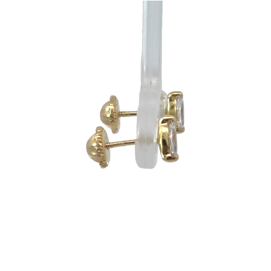 Close-up of XS 18k gold stud earrings with CZ stones