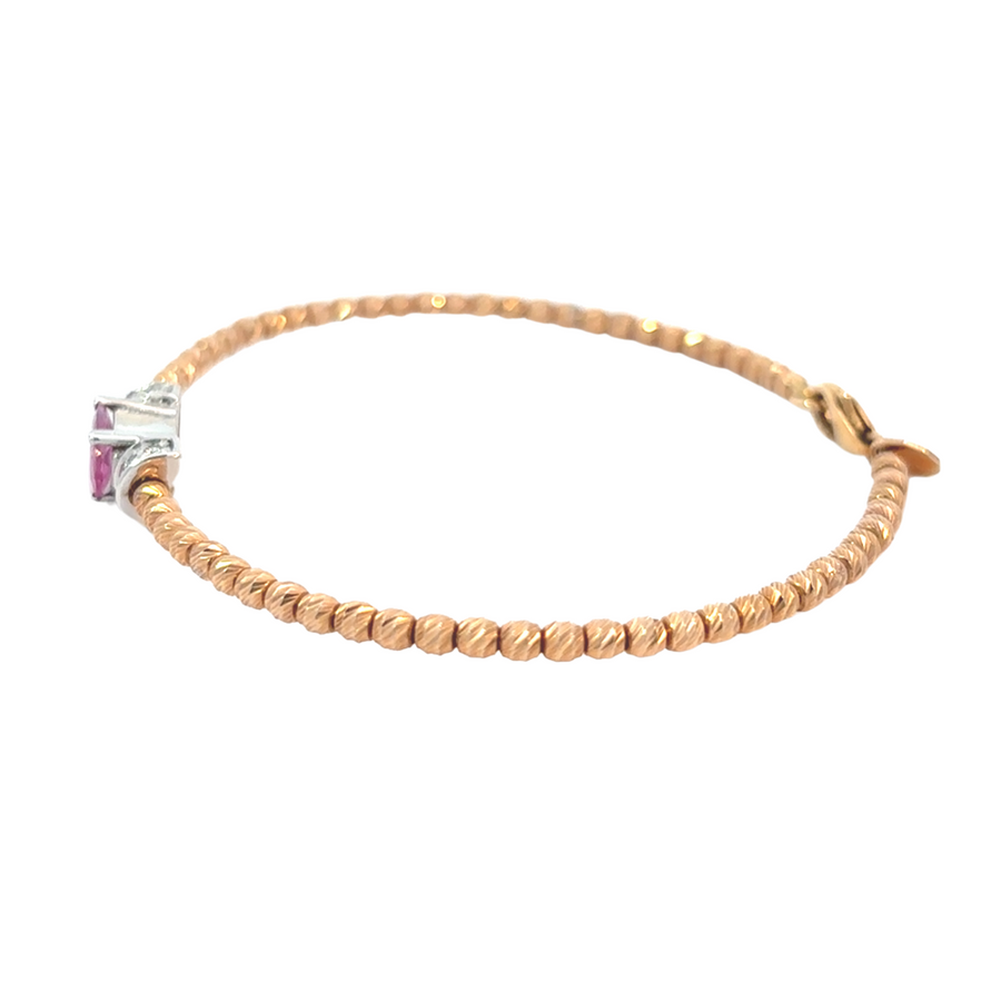 Side view of rose gold and diamond bracelet