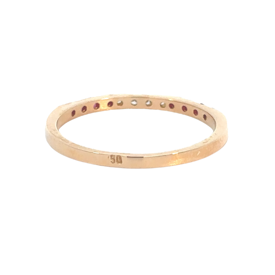 Diamond-accented rose gold ring with vibrant red ruby