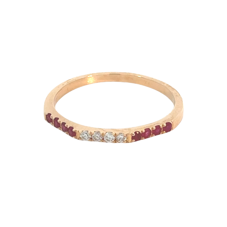 18k rose gold ring featuring a ruby center stone and diamond accents