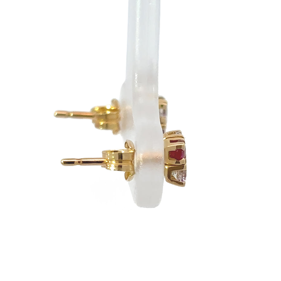 Delicate 18k gold baby studs with polished finish