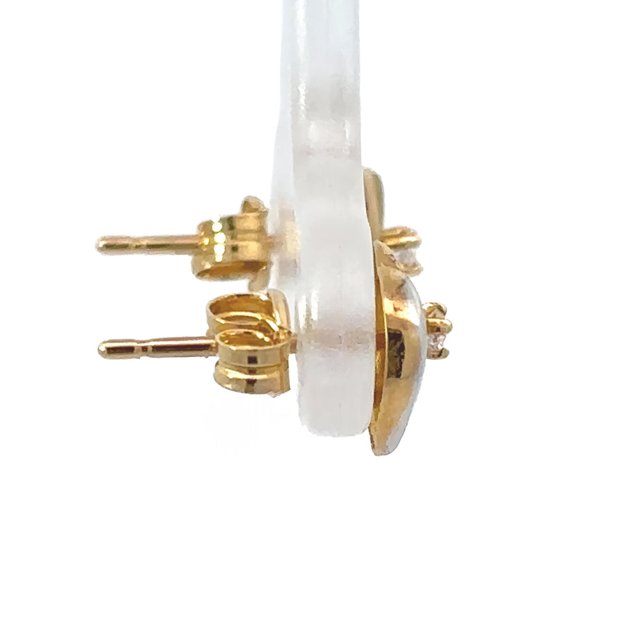 Smooth polished 18k gold baby earrings on white background
