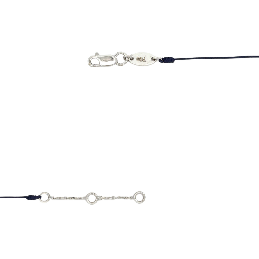 Woman wearing the white gold bracelet, showing the adjustable fit and chic design.