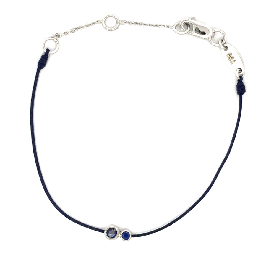 Close-up of the 18k white gold bracelet with a blue accent, highlighting the luxurious finish.