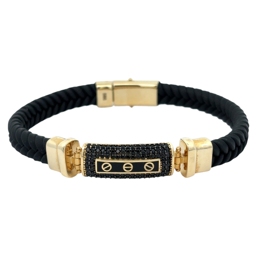 Close-up of 14k gold and leather men’s bracelet