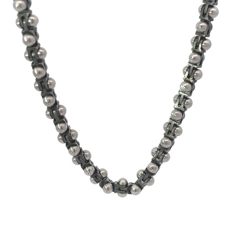 22-inch men’s carbon steel necklace with 18k gold and diamond accent on white background