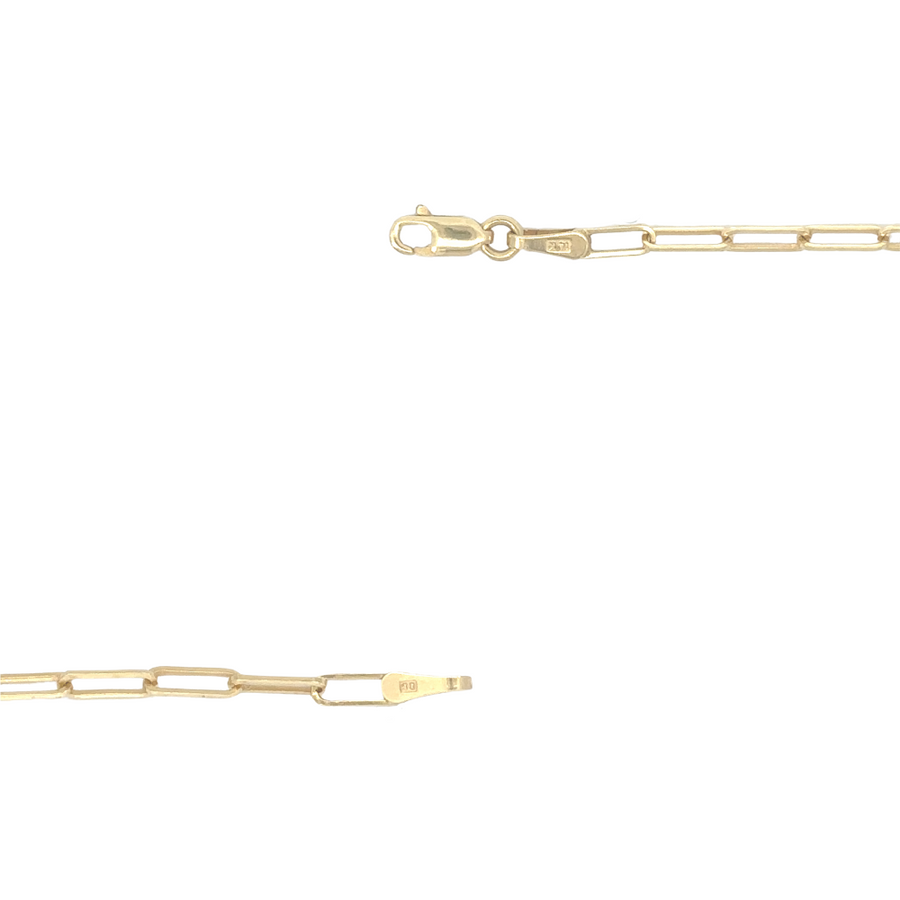 Chain draped on soft fabric showing smooth gold finish