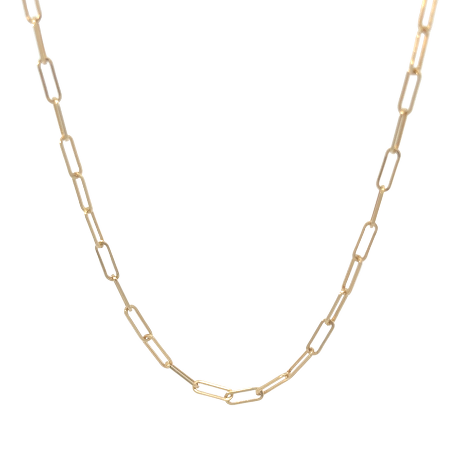 Model wearing 14k gold chain over a black shirt