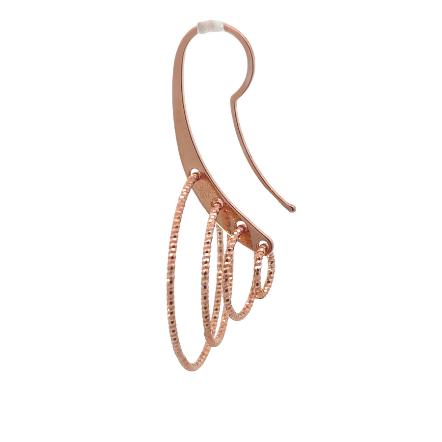Minimalist silver earrings styled on a model