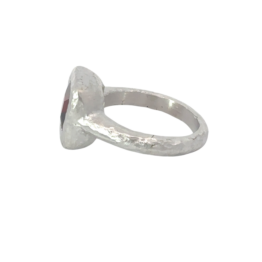 Ring, bracelet, and pendant in silver displayed together