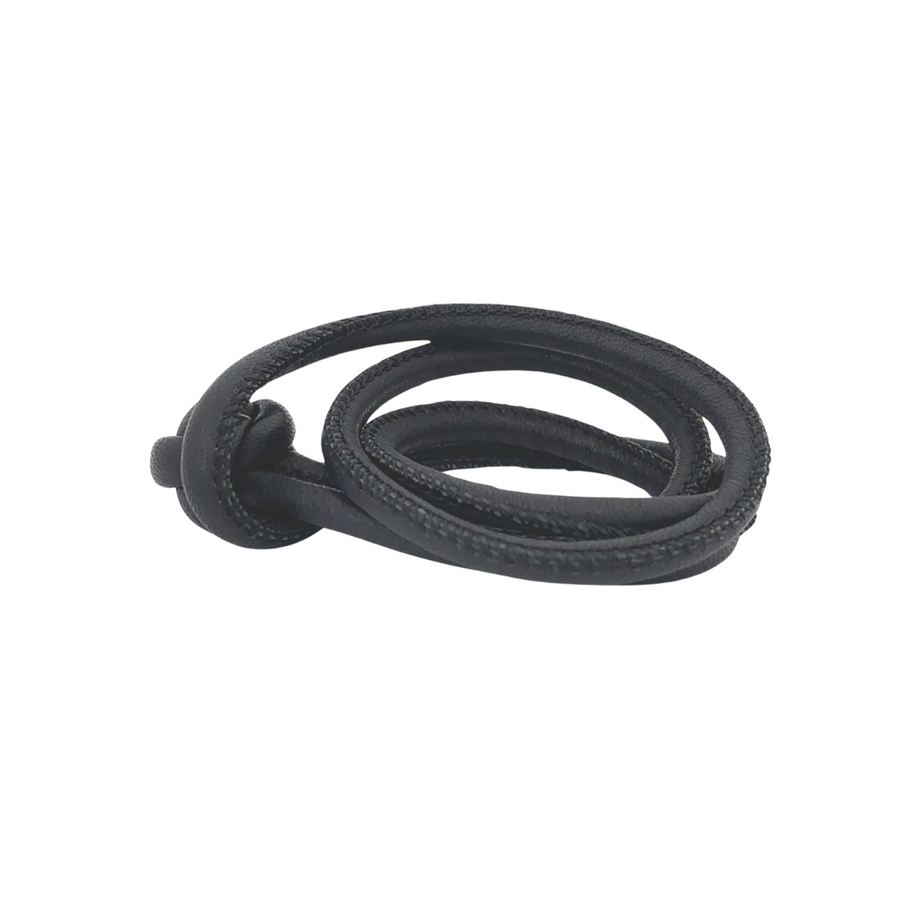 Close-up of black leather texture on bracelet
