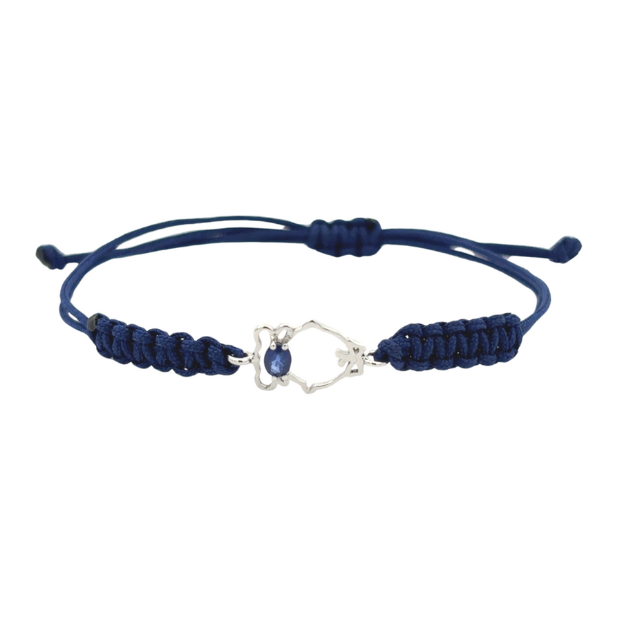 Close-up of 18k gold bracelet with delicate blue accent and baby design, showcasing intricate details.