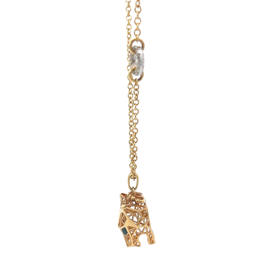 Model wearing 14k gold necklace with a minimalist outfit, showcasing its elegance