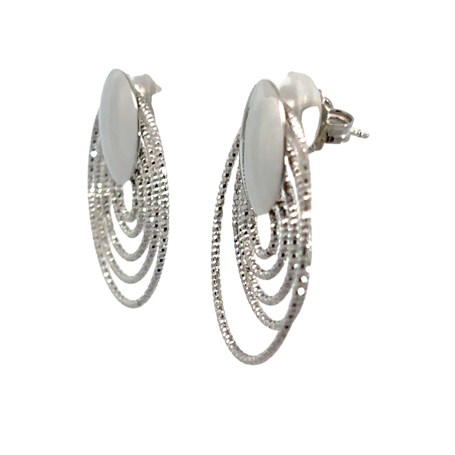 Close-up of minimalist silver stud earrings