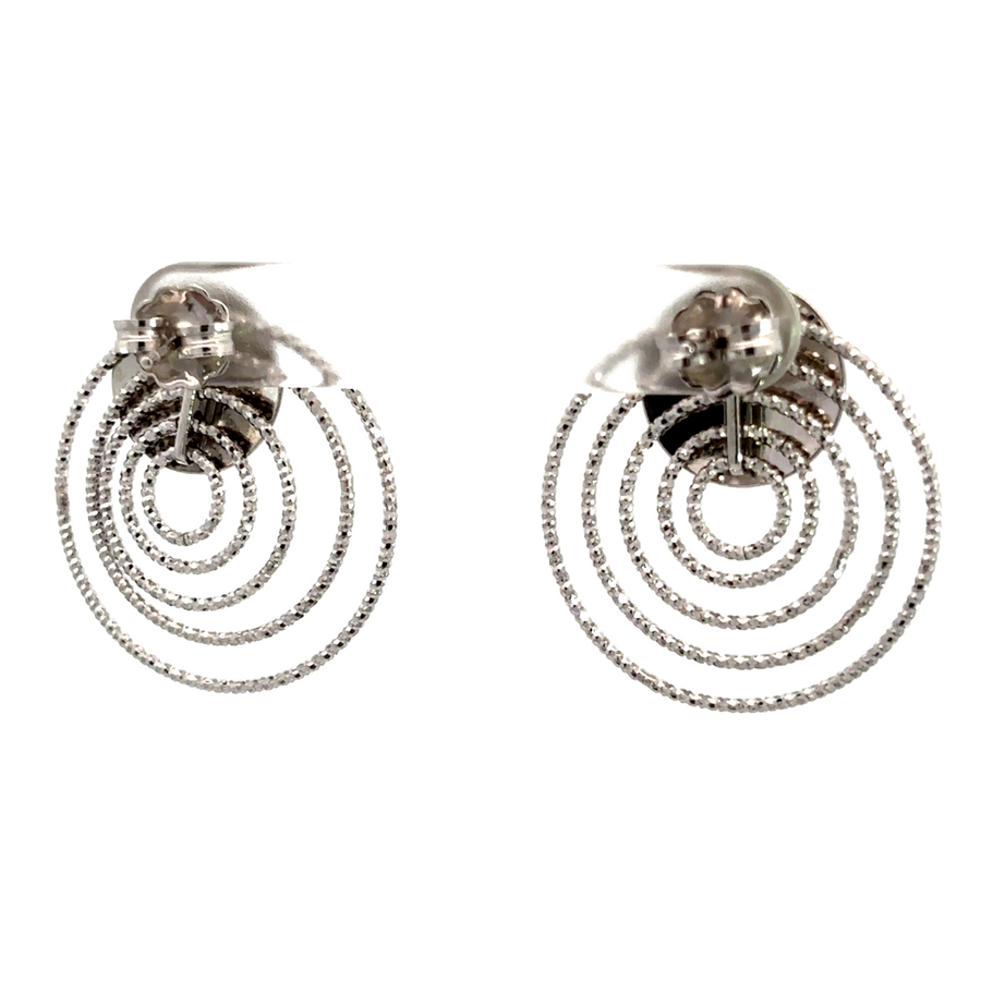 Lightweight silver studs resting on a white surface
