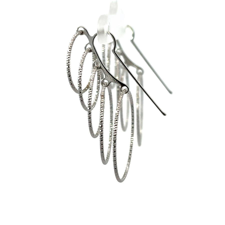 Close-up of high-polish silver earrings with timeless design