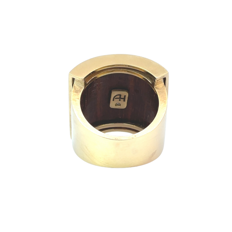 Ring with 18k gold band and wood inlay on white background