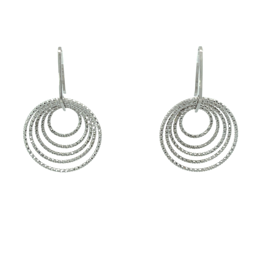 Diamond-cut small circle silver earrings on white background