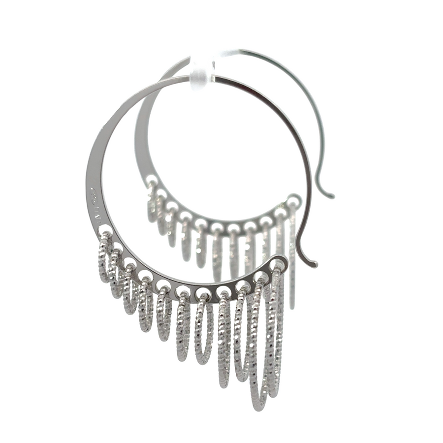 Close-up of diamond cut texture on silver earrings
