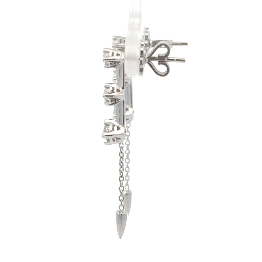 Woman wearing gold earrings with 0.22 CT diamonds