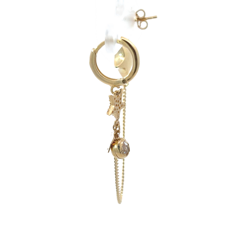 Model wearing 14k gold star earrings, showcasing their elegance and sparkle