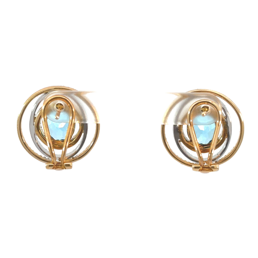 Side view of 14k gold diamond earrings on white background