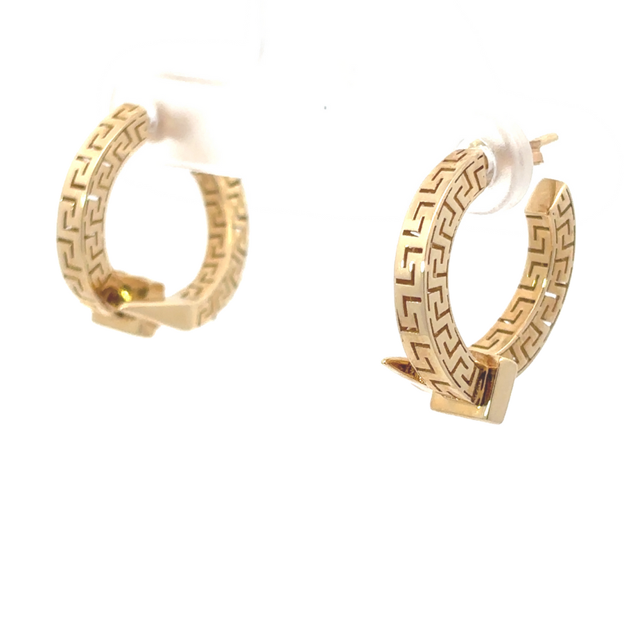 Close-up of 14k gold earrings with minimalist design on a white background
