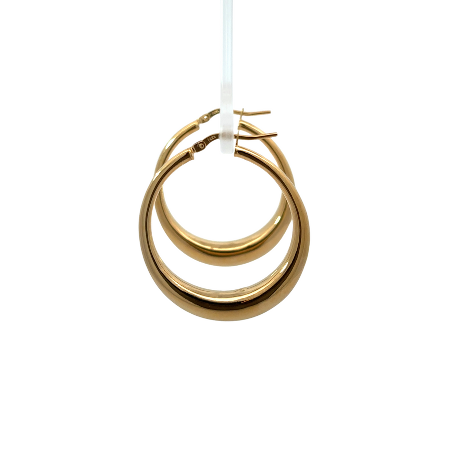 Pair of versatile 14k gold earrings in a jewelry box