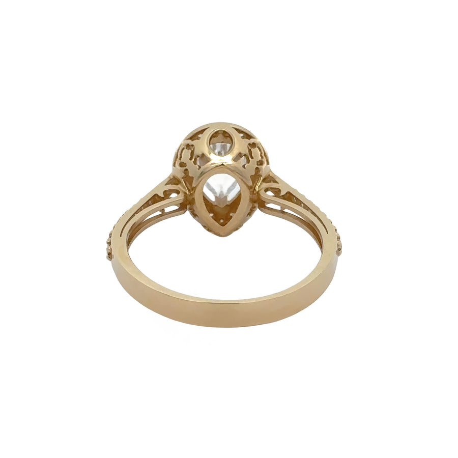 Woman’s hand wearing elegant 14k gold solitaire ring