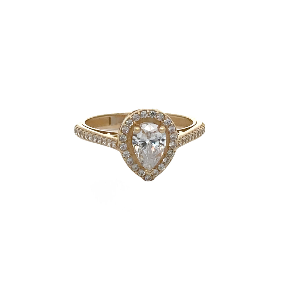Close-up of solitaire ring featuring sparkling gem in 14k gold
