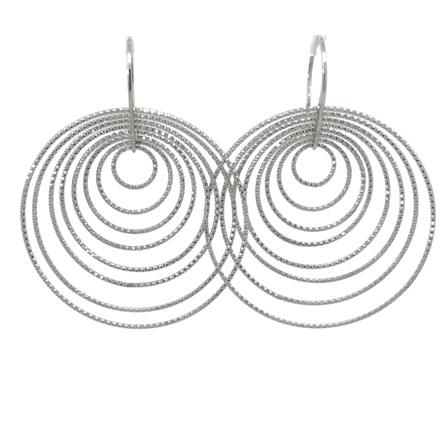 Close-up of minimalist circle silver earrings for women