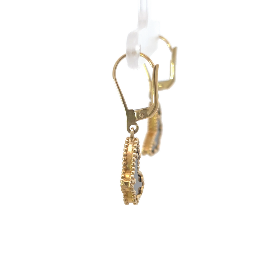 Earrings placed beside ring for cohesive styling inspiration