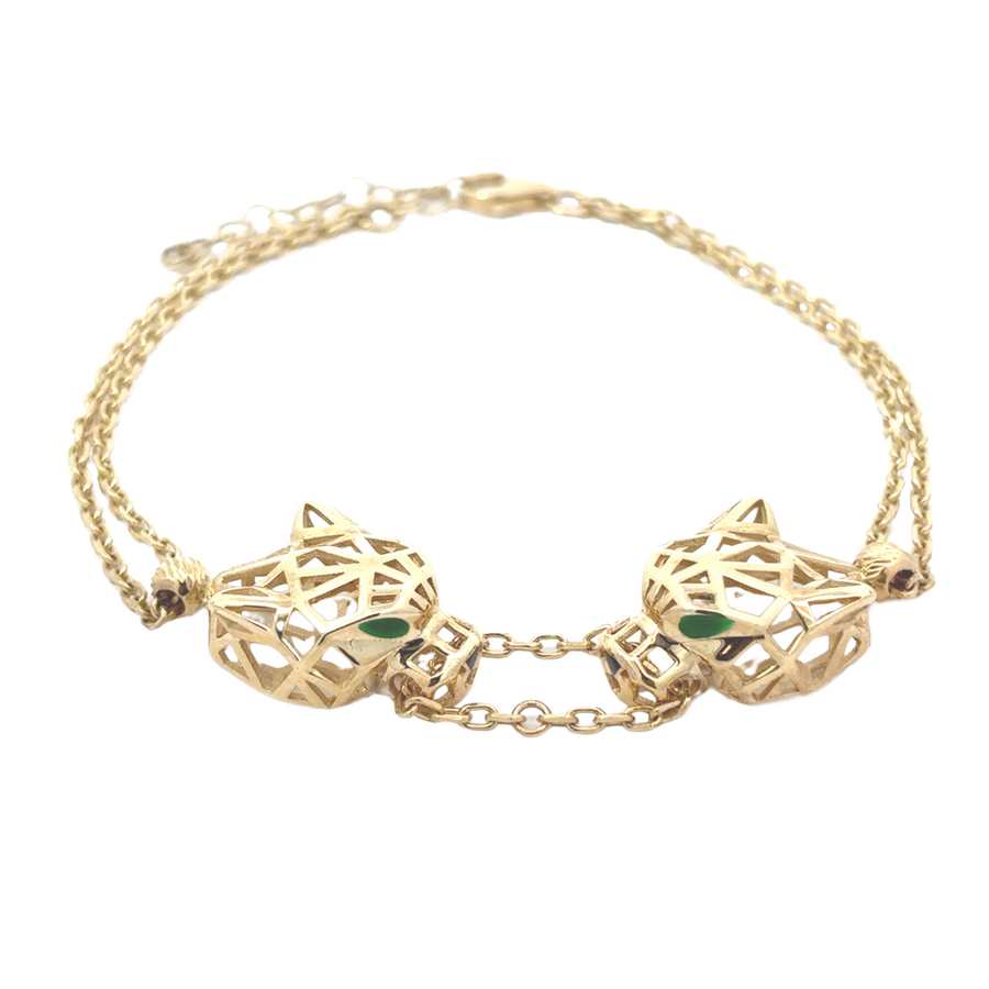 Flat-lay image of the adjustable 14k gold bracelet, emphasizing the sleek design and premium material