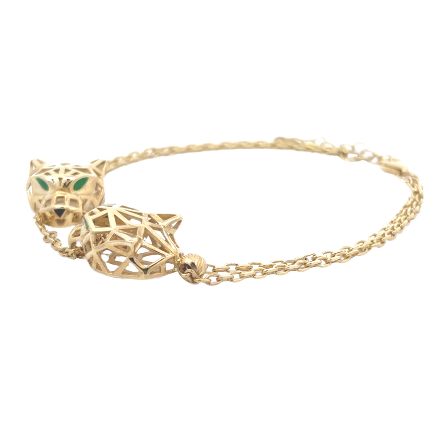 Model wearing the 14k gold bracelet, showcasing its fit and versatility in a casual outfit