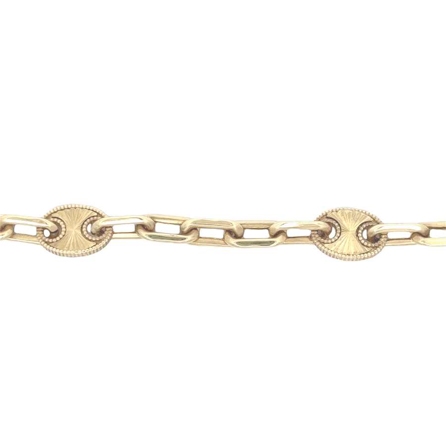 Woman wearing 14k gold bracelet with sleek and classic design