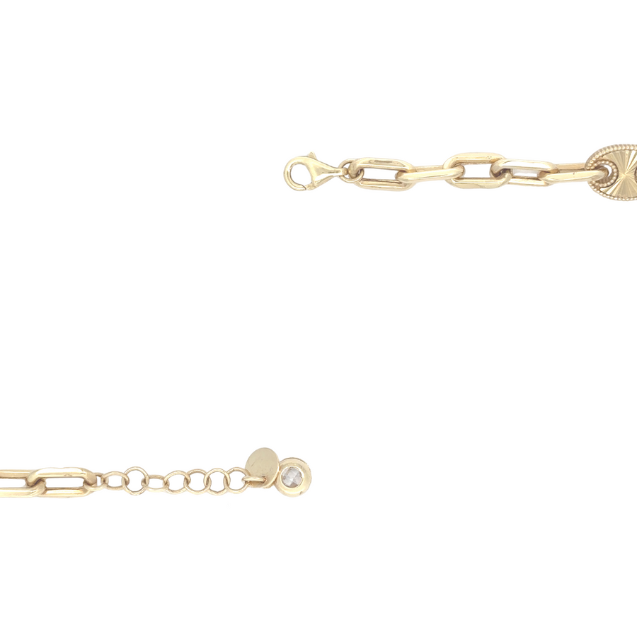 Elegant 14k gold bracelet displayed on neutral fabric surface