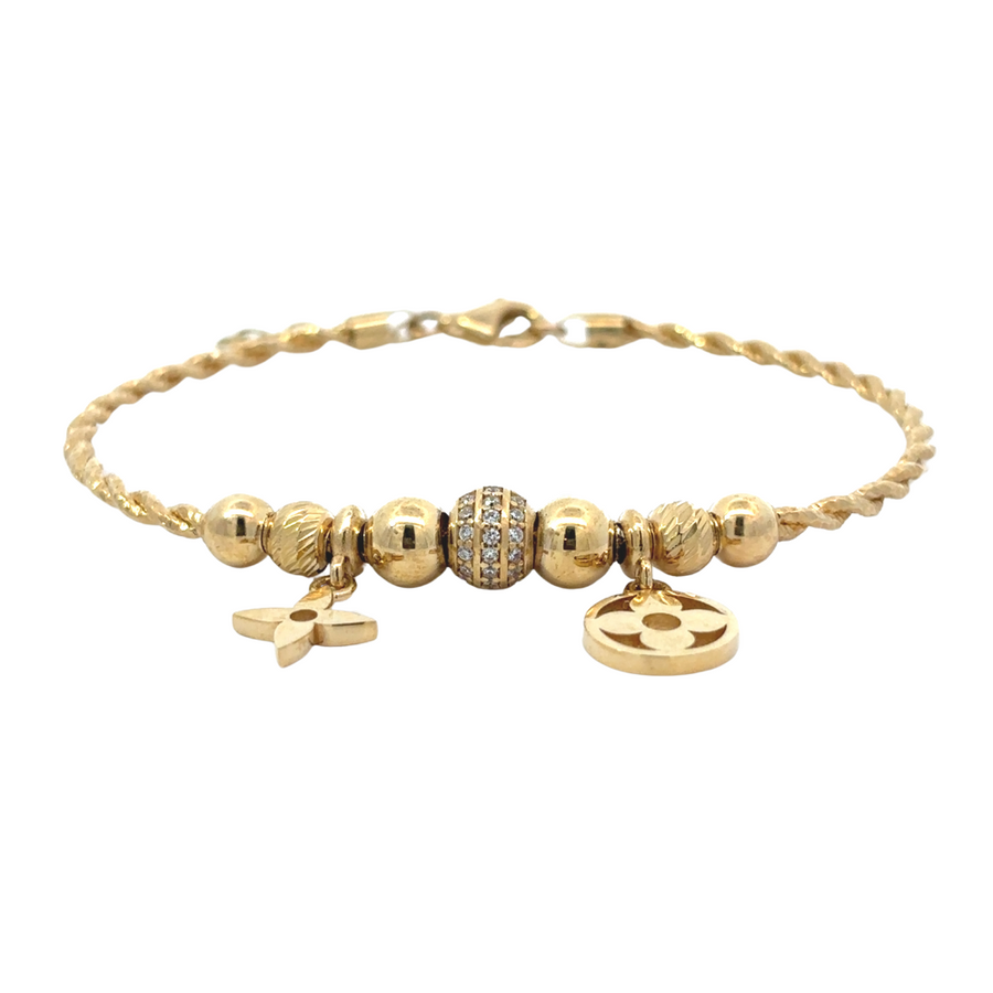 Flat-lay image of the 14k gold bracelet measuring 6.5 cm, highlighting its sleek structure