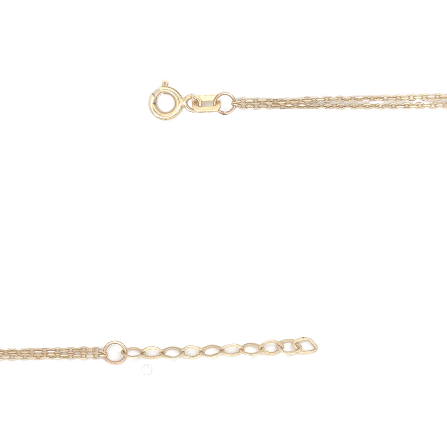 dainty gold bracelet with sparkling center stones