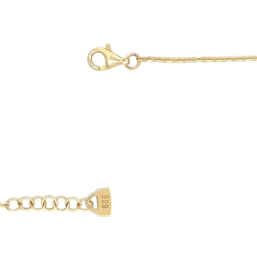 Close-up of the cubic zirconia stones on the necklace, displaying their brilliant sparkle against the gold chain