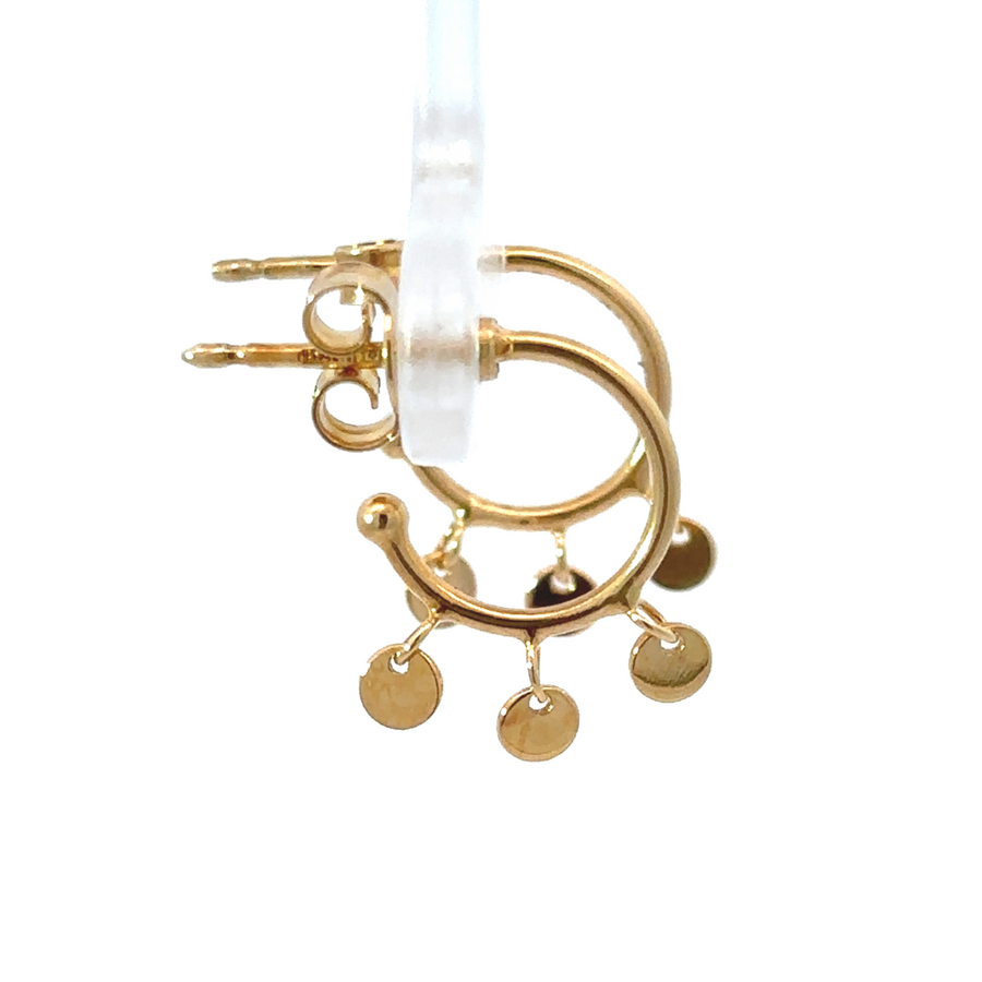 Side view of XS hoop earrings with dangling gold circles